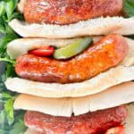 Air fryer Italian sausage, peppers, and onions served on steak rolls.