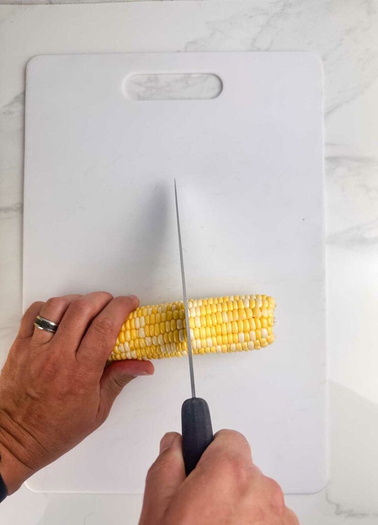 Chop corn on the cob in half.